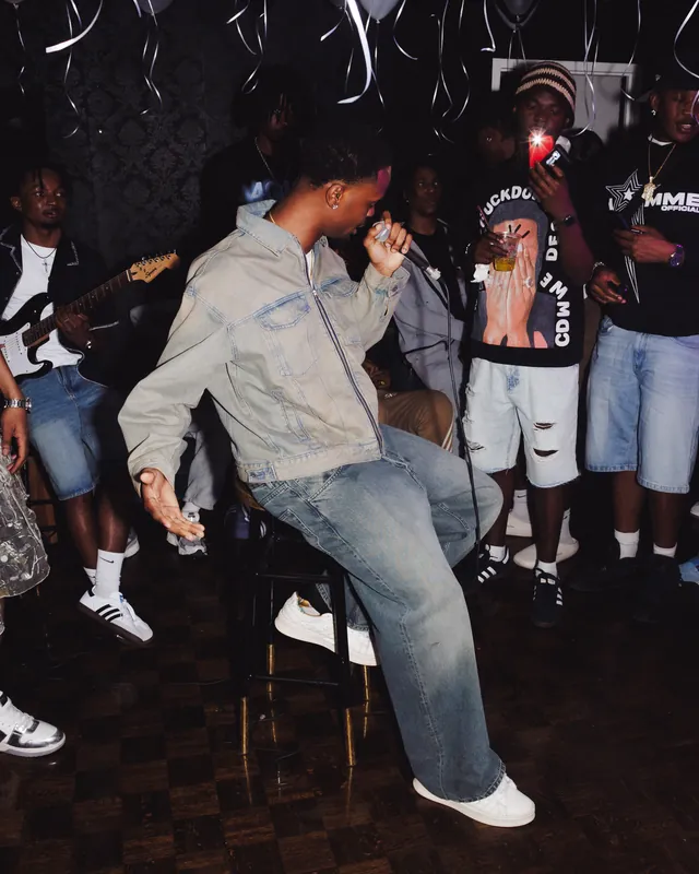 Guest dancing at a party with friends nearby